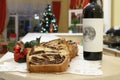 Festive rustic sliced Romanian sweet bread with cinnamon with wine on the side