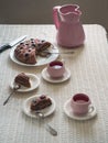 Festive rustic table with homemade cake and drink in ceramic mugs