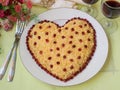 Festive salad in the shape of a heart, decorated with pomegranate seeds, the idea of decoration for Valentine`s Day, Horizontal