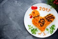 Festive salad shaped rooster or symbol of New Year 2017 Royalty Free Stock Photo