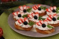 Festive sandwiches with crab sticks, feta cheese and black olives