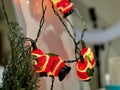 Festive Santa Claus Lights Garland Decorating Evergreen Branch, Christmas Decor Detail
