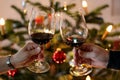 Festive scene of two people celebrating the holidays by toasting each other with glasses of wine Royalty Free Stock Photo