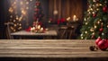 Festive background with wooden table and christmas decorations on Christmas tree. Royalty Free Stock Photo