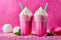 Festive setting with a vibrant pink bubble tea crowned with whipped cream and tapioca pearls. Royalty Free Stock Photo