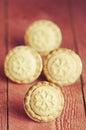 Festive shortcrust pastry mince pies. A sweet mince pie, a traditional rich festive food on red wooden background. Royalty Free Stock Photo