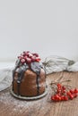 Festive small cake with chocolate and berries.