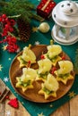 Festive snack of canapes on the Christmas table. Fruit canapes with cheese, kiwi and pineapple. Royalty Free Stock Photo