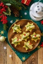 Festive snack of canapes on the Christmas table. Fruit canapes with cheese, kiwi and pineapple. Top view flat lay. Royalty Free Stock Photo