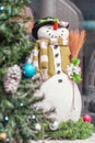 Festive snowman with Christmas light background.Festive snowman with Christmas light background