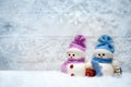 Festive snowmen on winter background