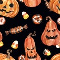 Watercolor cheerful halloween seamless pattern with hand painted spooky carved pumpkin heads and assorted holiday candies and