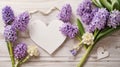 Festive spring greeting card on Mothers Day with hyacinth flowers and white wooden heart top view. Vintage style. Royalty Free Stock Photo