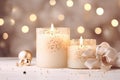 Festive still life with gift box, burning candles and Christmas decorations on bokeh background. Christmas composition for home