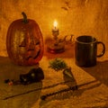 Festive still life with pumpkin and mystical paraphernalia