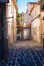 Festive street decoration in Lisbon, Portugal. Narrow medieval street with flower garlands and flags. Siesta concept.