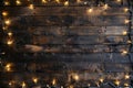 Festive string lights on a rustic wooden background Royalty Free Stock Photo