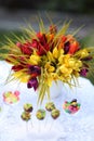 A festive table decorated with birthday cake with flowers and sweets. Royalty Free Stock Photo