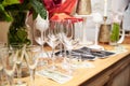 Festive table with delicious appetizers and snacks. Holiday banquet serving with fancy glasses and silverware in restaurant. Royalty Free Stock Photo