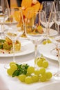 Festive table glasses for Champagne and grapes Royalty Free Stock Photo