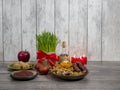 Festive table in honor of Navruz. Wheat with a red ribbon, the traditional holiday of the vernal equinox Nawruz