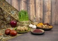 Festive table in honor of Navruz. Wheat with a red ribbon, the traditional holiday of the vernal equinox Nawruz