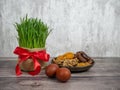 Festive table in honor of Navruz. Wheat with a red ribbon, the traditional holiday of the vernal equinox Nawruz