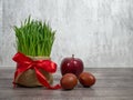 Festive table in honor of Navruz. Wheat with a red ribbon, the traditional holiday of the vernal equinox Nawruz