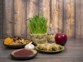 Festive table in honor of Navruz. Wheat with a red ribbon, the traditional holiday of the vernal equinox Nawruz