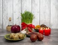 Festive table in honor of Navruz. Wheat with a red ribbon, the traditional holiday of the vernal equinox Nawruz