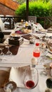 Festive table with scraps of food and dirty dishes after the banquet. Celebration in nature