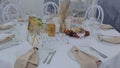 Festive table setting, chair, flower reception. Wedding dinner catering, indoor reception. Served tables for a holiday Royalty Free Stock Photo