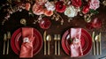 Festive table setting with cutlery, candles and beautiful red flowers in vase Royalty Free Stock Photo