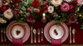 Festive table setting with cutlery, candles and beautiful red flowers in vase Royalty Free Stock Photo