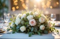 Festive table setting features floral centrepiece with roses plants. Sunlight streams through windows creating bokeh effect. Wine Royalty Free Stock Photo