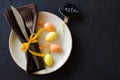 Festive table setting for holiday Easter dinner on dark table. Royalty Free Stock Photo