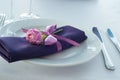 Festive table setting in the restaurant with flowers. Royalty Free Stock Photo