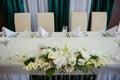 Festive table setting in the restaurant with flowers Royalty Free Stock Photo