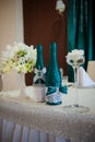 Festive table setting in the restaurant with flowers Royalty Free Stock Photo