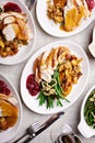 Festive Thankgiving dinner table with plates of food Royalty Free Stock Photo