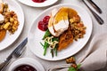 Festive Thankgiving dinner table with plates of food Royalty Free Stock Photo