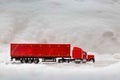 Festive truck in red. toy car rides on the background of real snowdrifts. Winter. Christmas holidays
