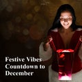 Festive vibes countdown to december text and happy caucasian woman with glowing christmas gift bag