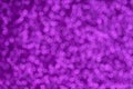 Festive violet pattern background. Holiday glowing party decoration. Magic illuminated lights