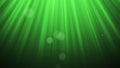 Festive volume light rays with glitter particles bokeh looped animated abstract cg motion green background.