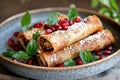 Festive walnut pastries with pomegranate on a plate for holiday celebrations Royalty Free Stock Photo