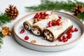 Festive walnut pastries with pomegranate on a plate for holiday celebrations Royalty Free Stock Photo
