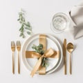 Festive table setting with golden cutlery on white table background. Flat lay, top view. Empty created with Generative AI
