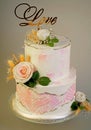 Festive wedding bunk cake decorated with fresh flowers on a dark background Royalty Free Stock Photo