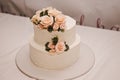 Festive wedding cake with flowers, pink-orange flowers, bunk, beautiful